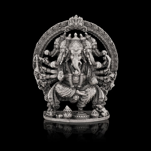 Silver Idol Ganesh siting with Prabavali