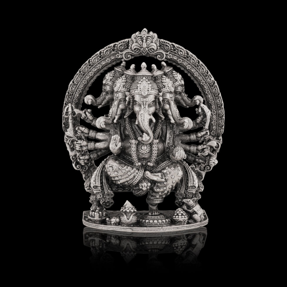 Silver Idol Ganesh siting with Prabavali