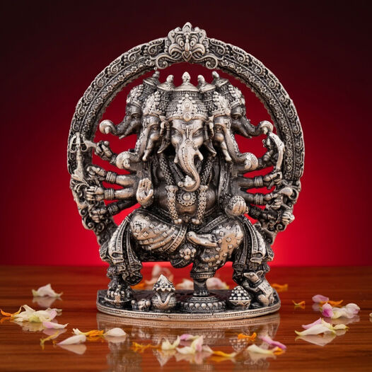 Silver Idol Ganesh siting with Prabavali