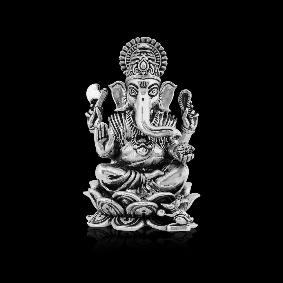 Silver Idol Ganesh siting w/o Prabhavali