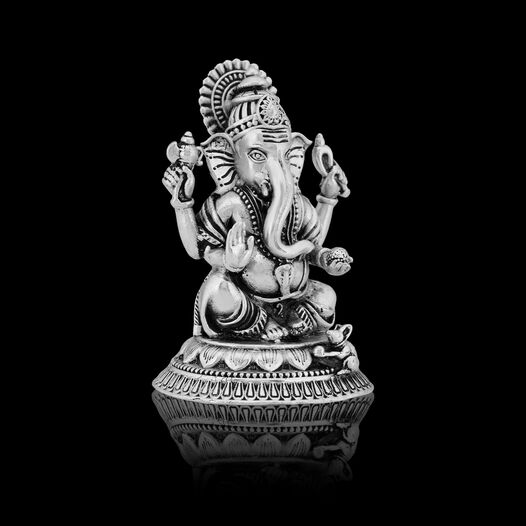 Silver Idol Ganesh siting w/o Prabhavali