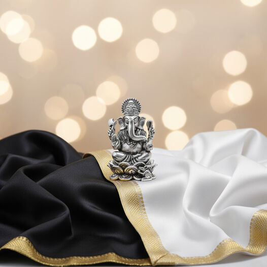Silver Idol Ganesh siting w/o Prabhavali