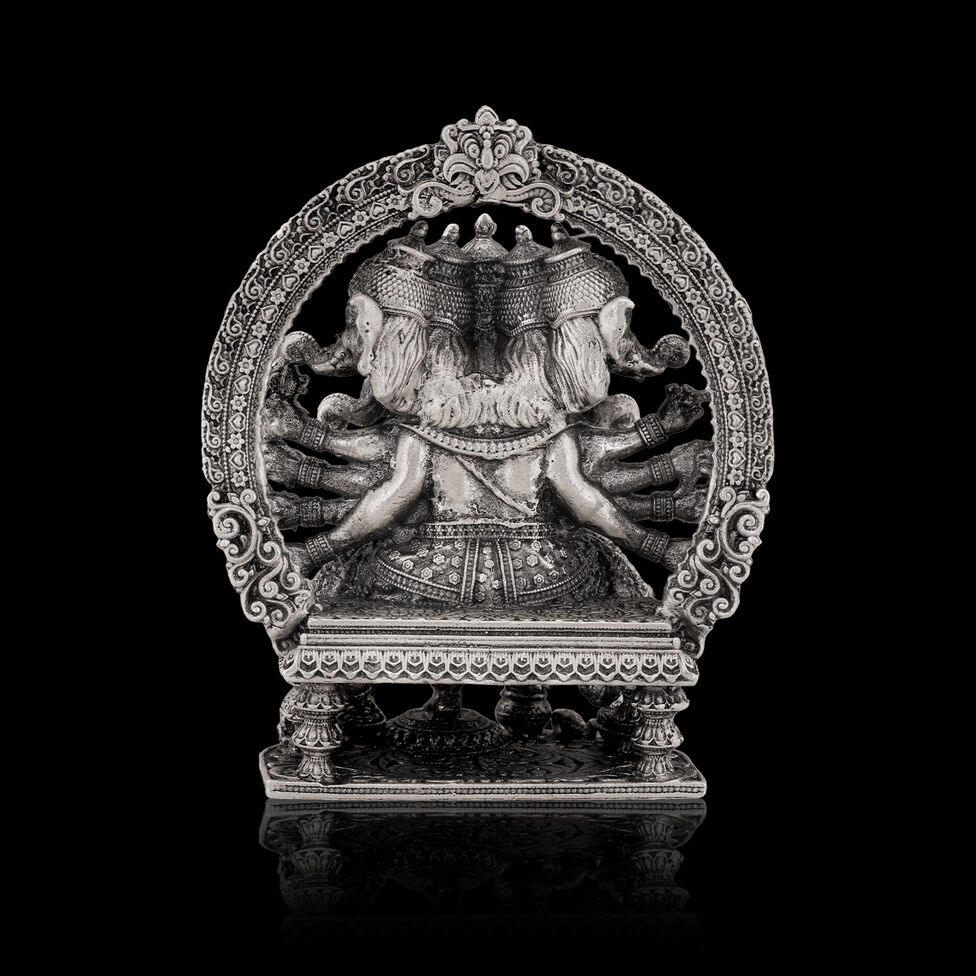 Silver Idol Ganesh siting with Prabavali