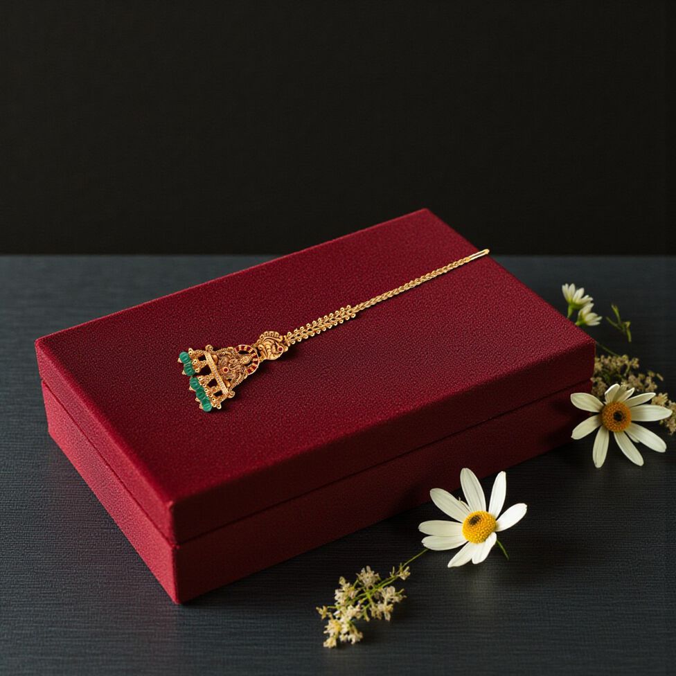 GOLD HEAD ORNAMENT/TEEKA IN REPOUSSEWORK