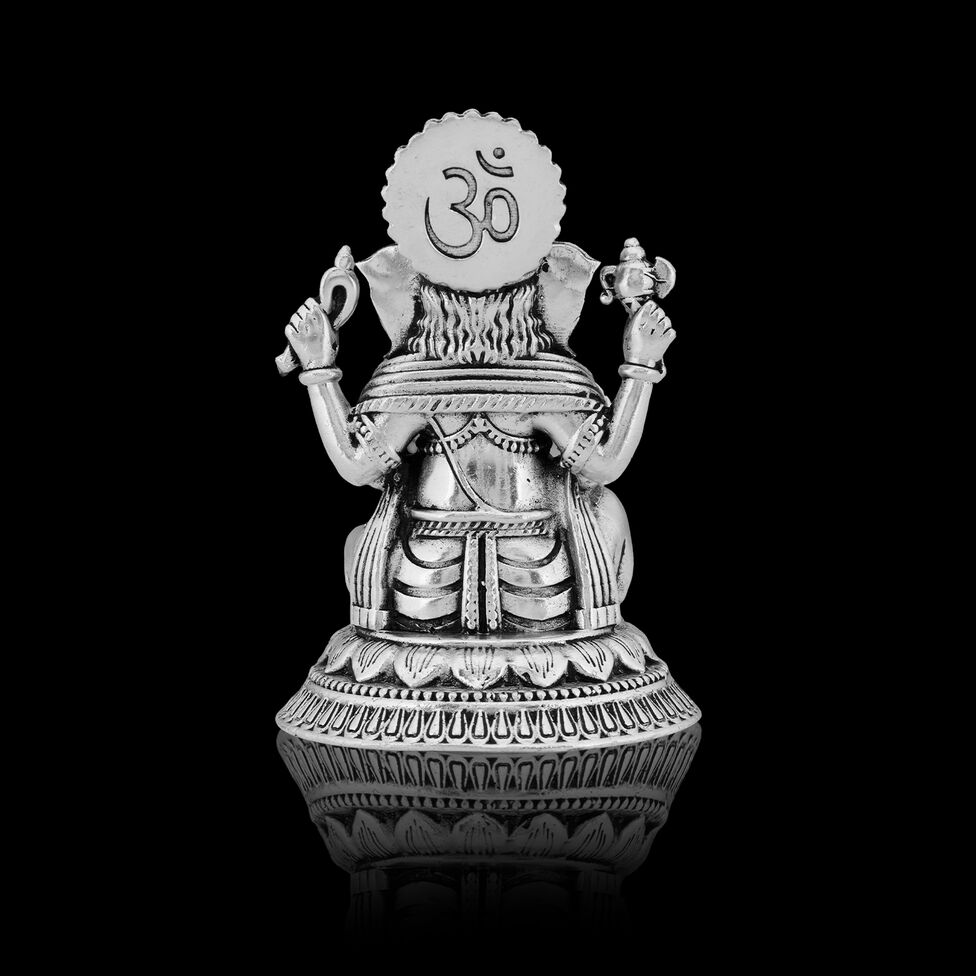 Silver Idol Ganesh siting w/o Prabhavali