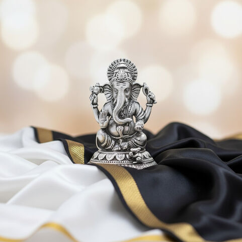 Silver Idol Ganesh siting w/o Prabhavali